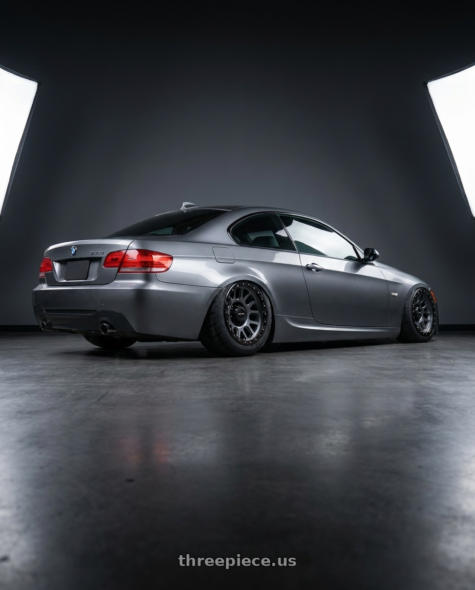 2009 e92 335i m sport highline coupe, space grey with Vision Off-Road 111 Nemesis 6x135 20x9+18 Gunmetal wheels rear three quarter view meaty tires