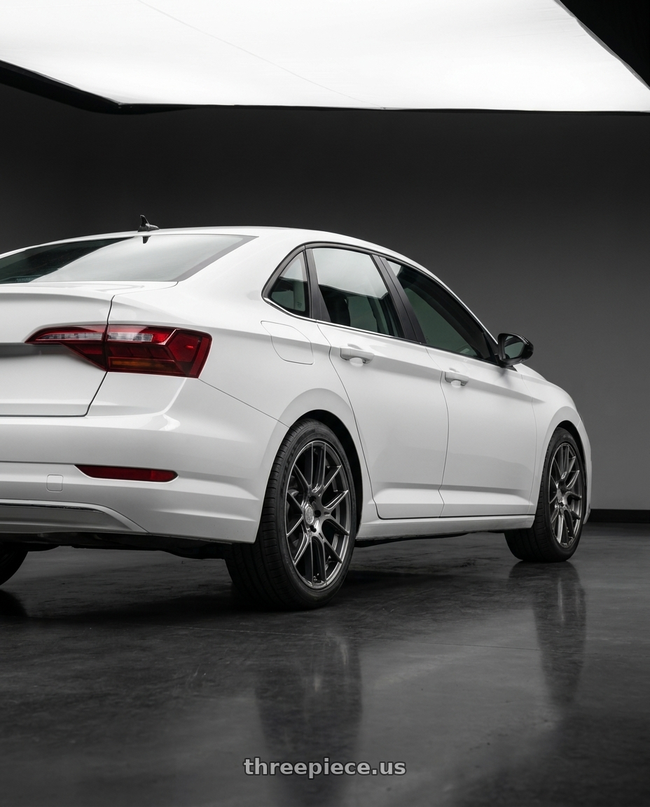 2026 vw jetta with Aodhan AH-X 5x112 18x8.5+35 Hyper Black wheels rear three quarter view square tires