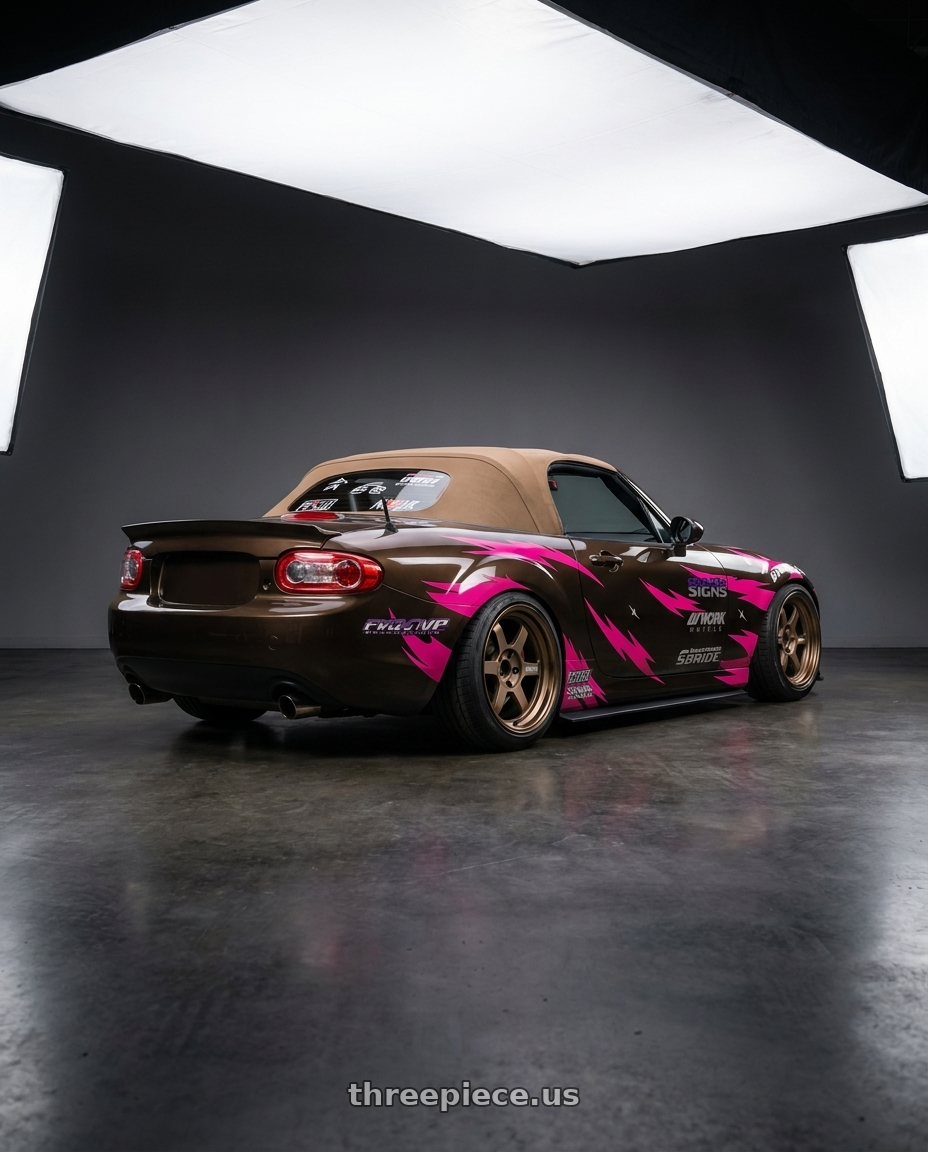 2012 Mazda Miata  with Volk Racing TE37V 10th Anniv 4x100 17x7.5+30 Bronze wheels rear three quarter view slight stretch tires