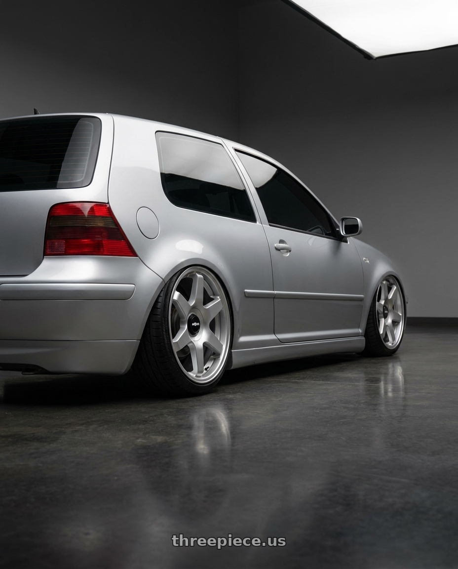 2002 VW GTI with Rotiform 1PC R114 SIX 5X100/5X112 18X8.5 +35 GLOSS SILVER wheels rear three quarter view slight stretch tires