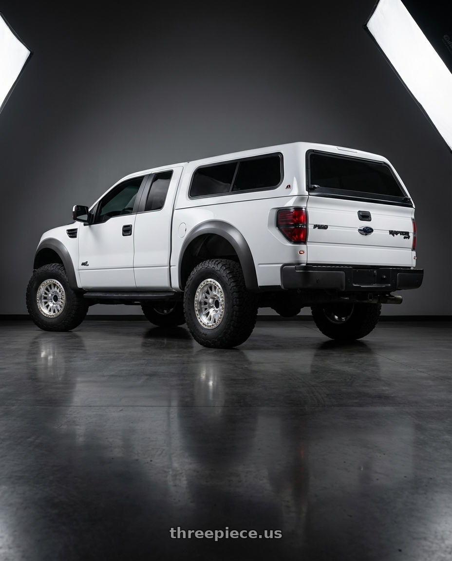 2013 Ford SVT Raptor SuperCab with KMC KM445 IMPACT FORGED BEADLOCK BLANK 17x9 +0 RAW MACHINED wheels rear three quarter view meaty tires