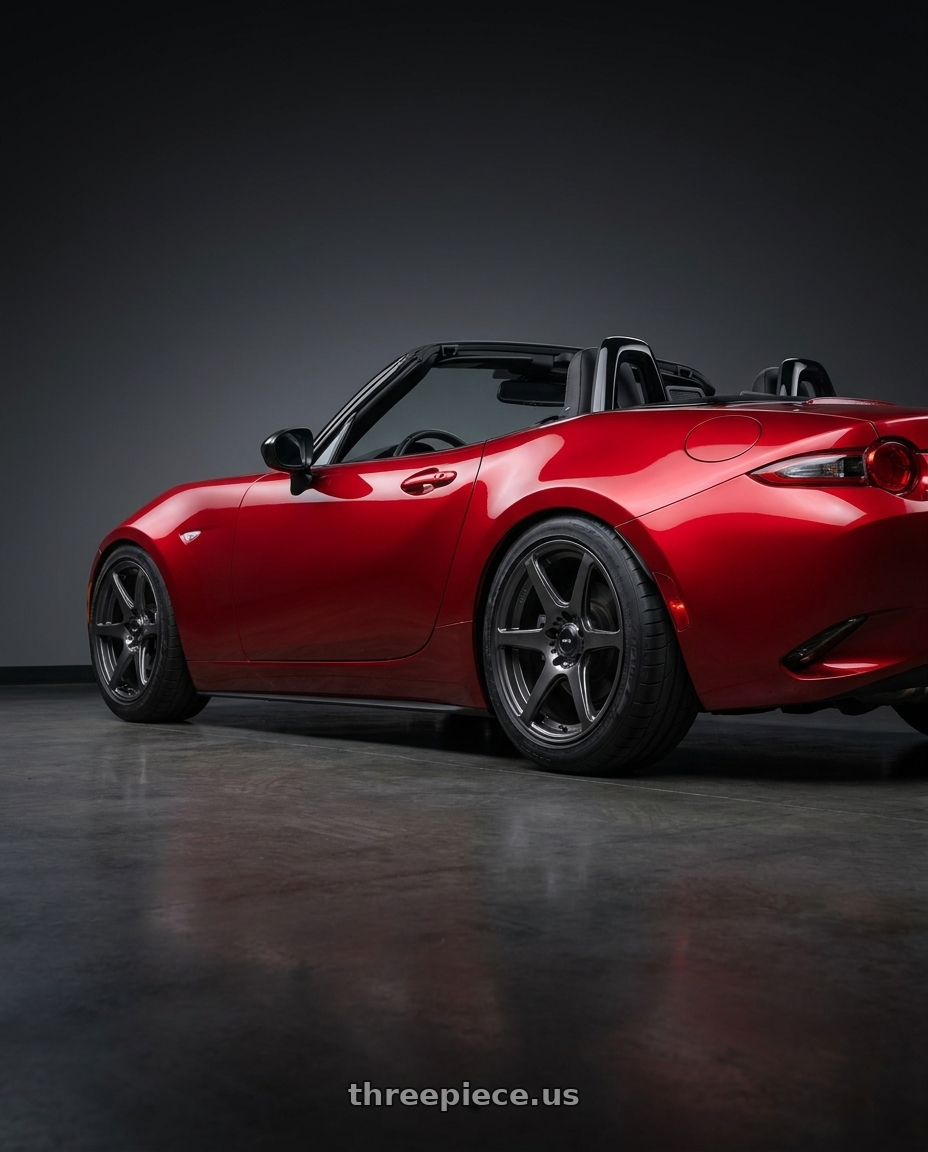 2016 Mazda Miata with Konig Tandem 4x100 16x7.5+40 Gloss Graphite wheels rear three quarter view meaty tires