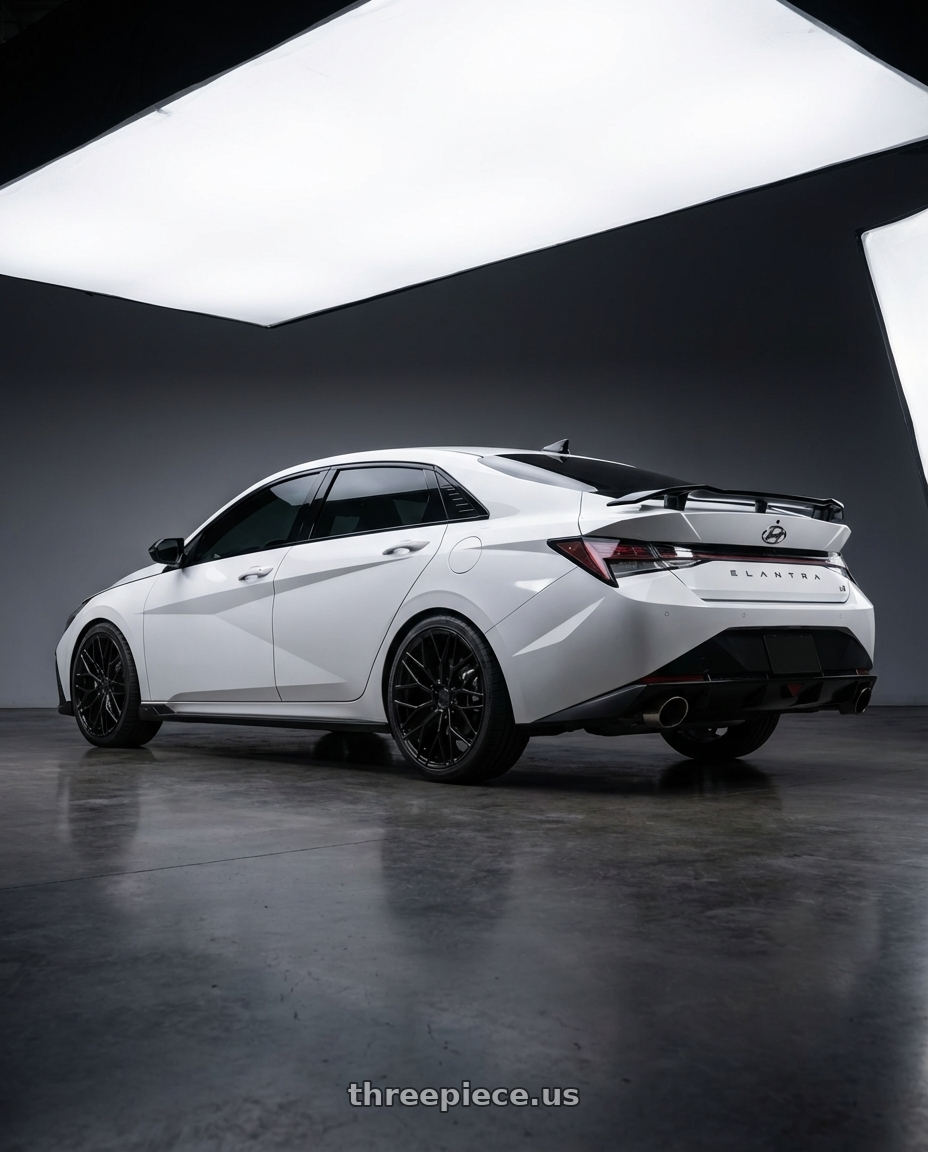 2024 Hyundai Elantra N with Avant Garde Wheels M520R 5X114.3 19x8.5 +35 Gloss Black wheels rear three quarter view square tires