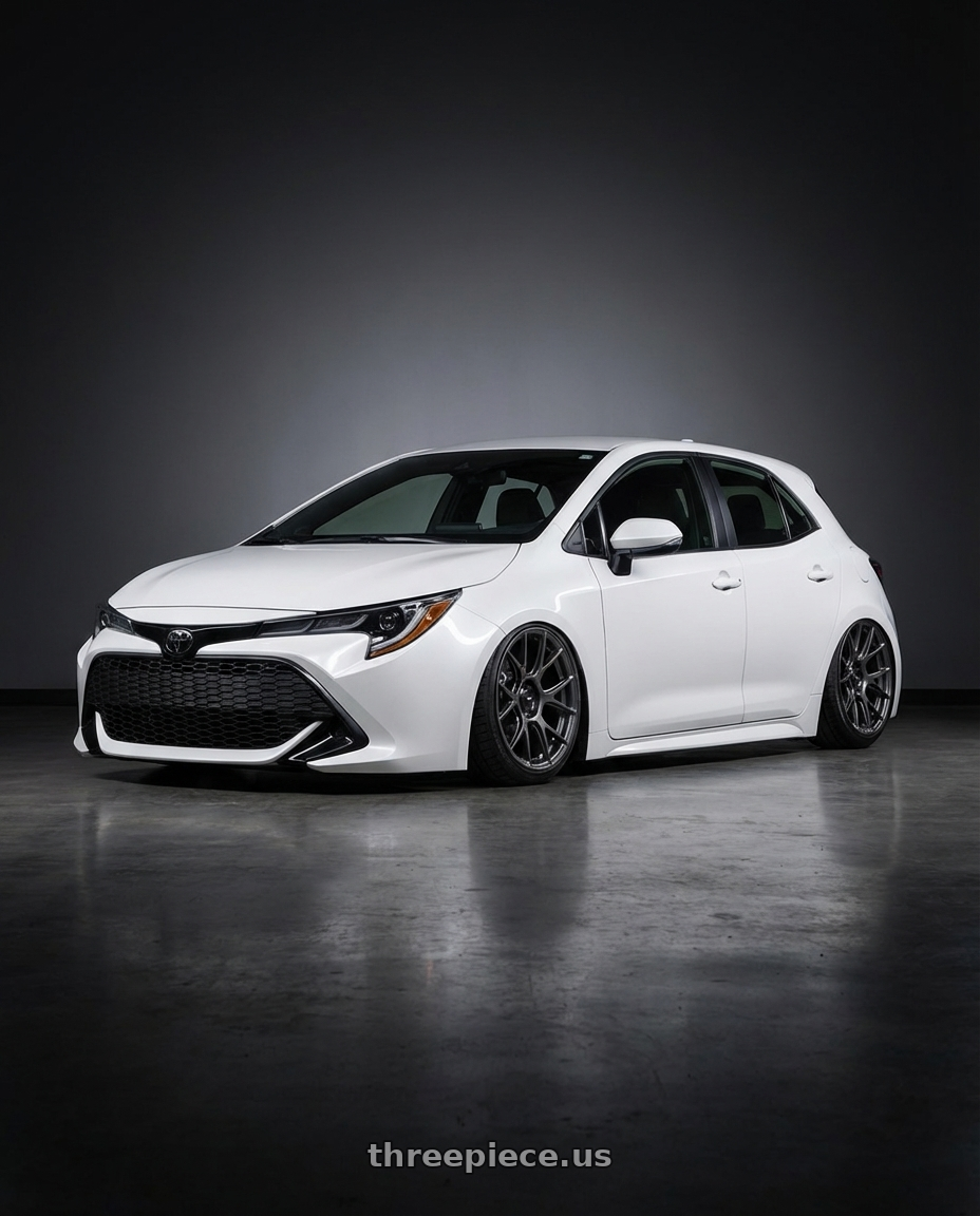 2023 Toyota Corolla Hatchback with Konig Ampliform 5x114.3 18x9.5+35 Dark Metallic Graphite wheels