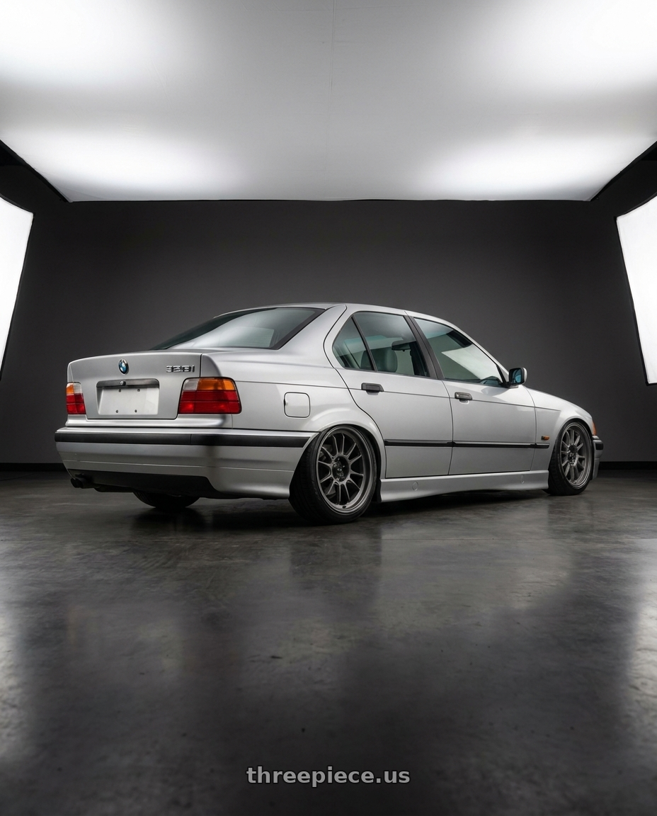 1996 BMW 328i with Konig 47MG Hypergram 5x120 18x8.5 +35 Matte Grey wheels rear three quarter view slight stretch tires