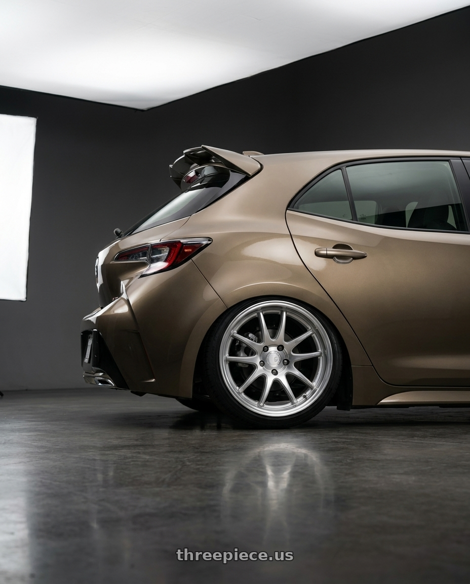 2019 Corolla hatch se oxidize bronze with spoiler with Aodhan DS02 5X100 18x8.5+35 Silver w/Machined Face wheels rear three quarter view slight stretch tires