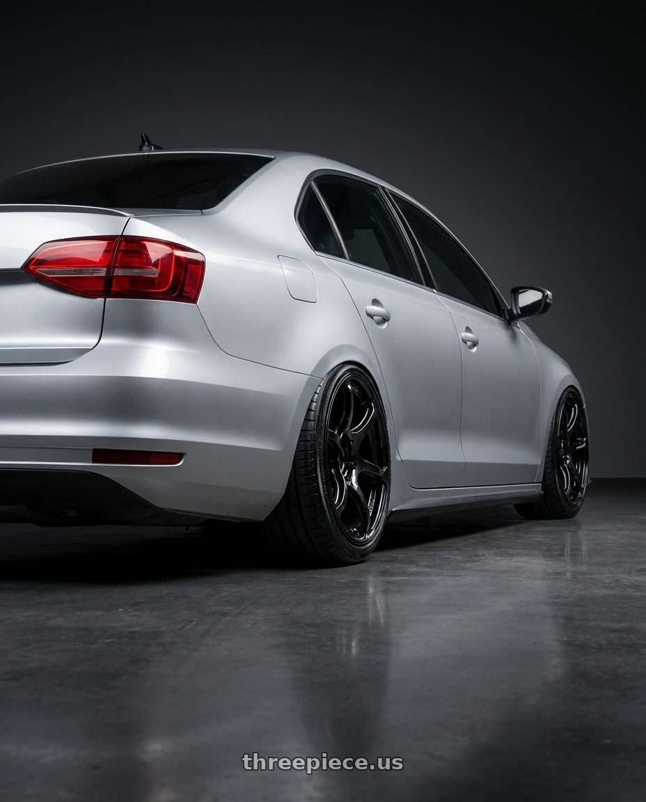 2016 Volkswagen Jetta GLI MK6 with Advan RGIII 5x112 18x8+50 Gloss Black wheels rear three quarter view slight stretch tires