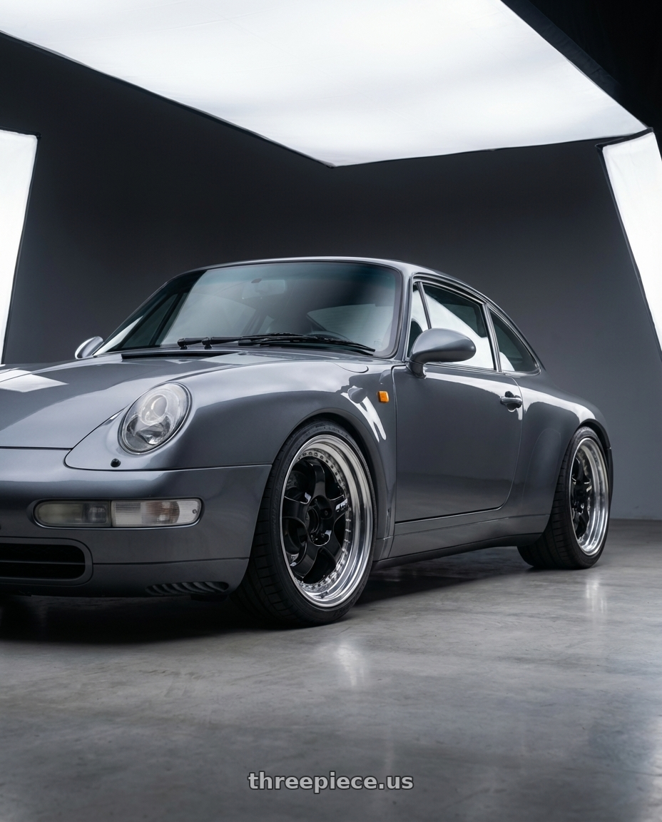 1994 Porsche 911 Carrera slate grey with Work Meister S1 3P 5x100 18x10+60 A Disk Black wheels front three quarter view lowered stance