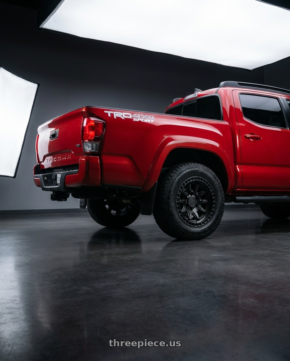 2016 Tacoma TRD Sport with Black Rhino CALICO 6X139.7 17X8.5 0 MATTE BLACK wheels rear three quarter view square tires
