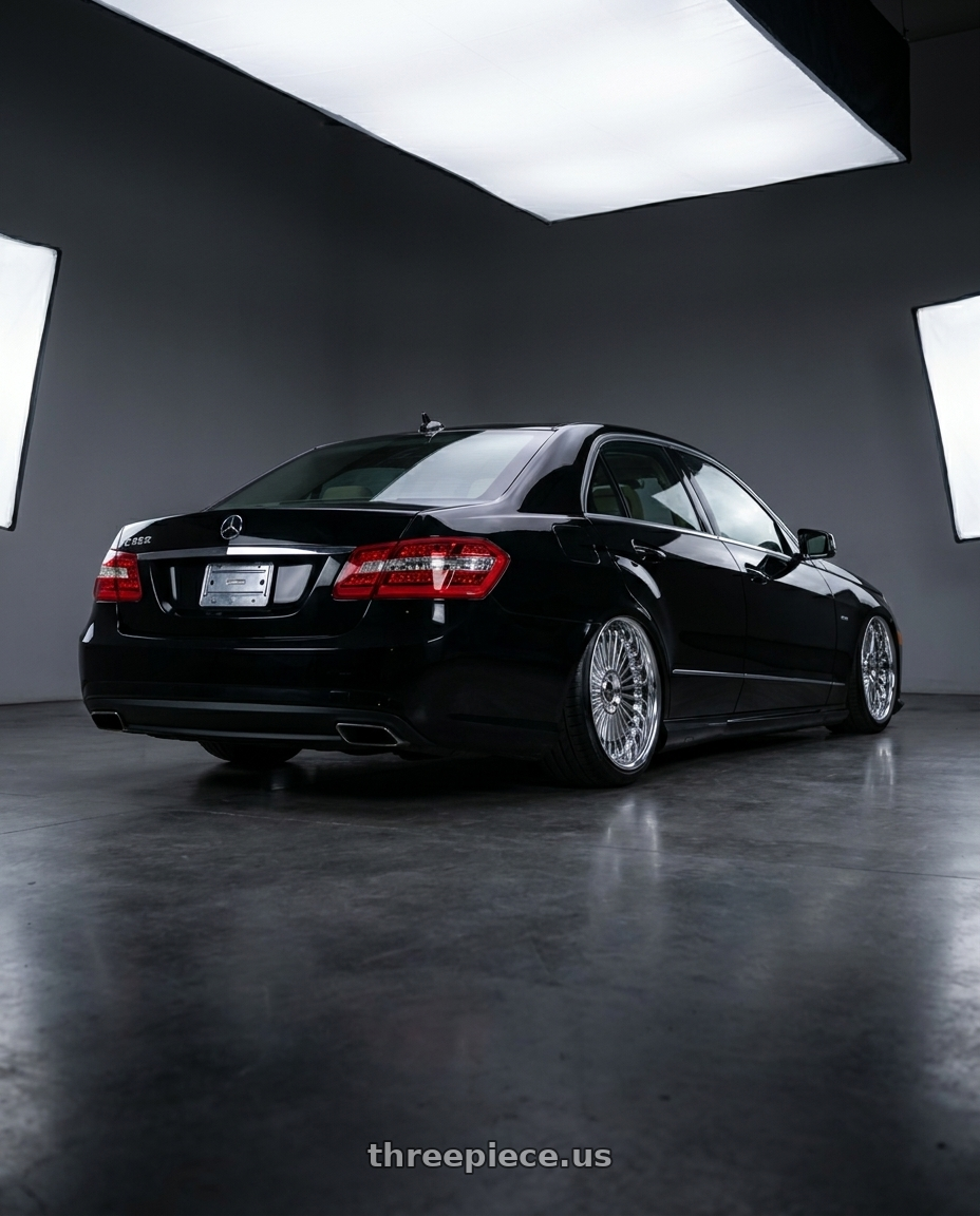 2012 Mercedes E350 with Work Emitz wheels rear three quarter view slight stretch tires