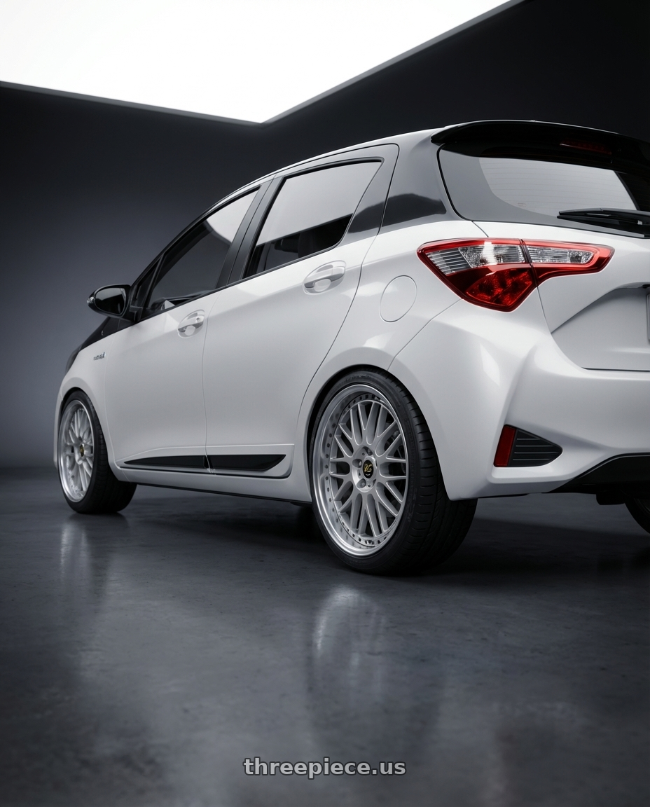 2020 Toyota Yaris Y20 with Work Vs-Xx 5x100 18x7.5+32 A Disk Light Grey Silver wheels rear three quarter view square tires