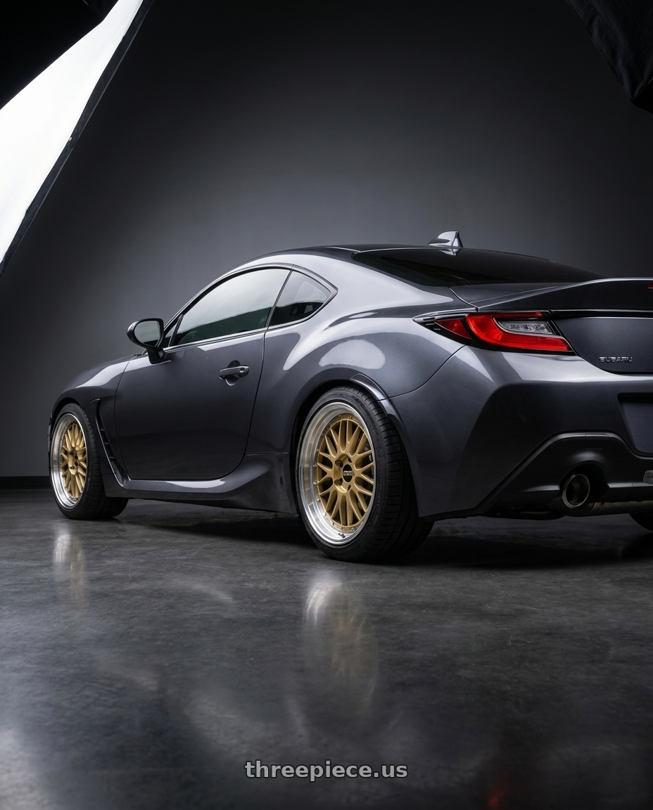 2023 Subaru BRZ premium Magnetite grey  with BBS LM 5x100 18x8.5 +45 Gold Center Diamond Cut Lip wheels rear three quarter view square tires