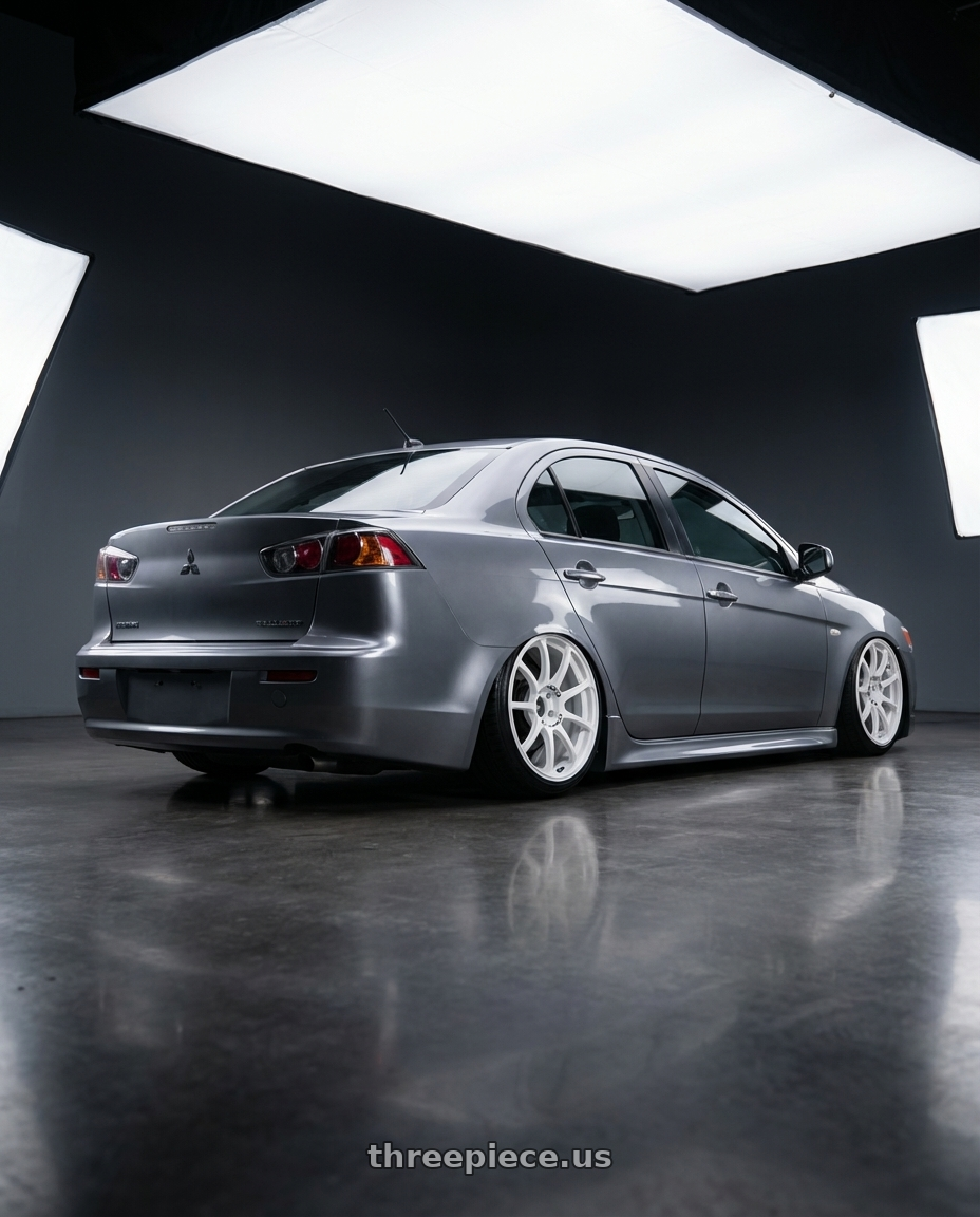 2014 Mitsubishi Lancer Ralliart with Advan RCIII 5x114.3 18x7.5+45 White wheels rear three quarter view slight stretch tires