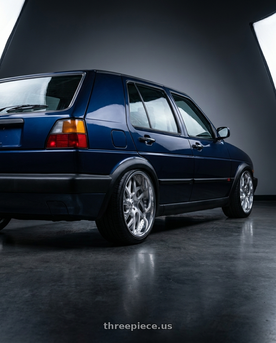 1990 vw golf mk2 hatchback 5 doors , dark blue with Amani Apollo 5x112/5x114.3 22x9 +32 Brush Center Chrome Lip wheels rear three quarter view square tires