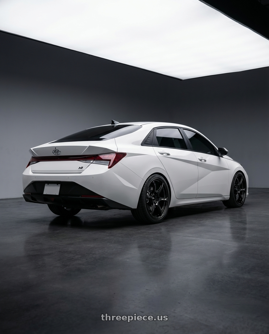 2024 Hyundai Elantra N with Advan RGIII 5x114.3 19x9.0+25 Gloss Black wheels rear three quarter view square tires