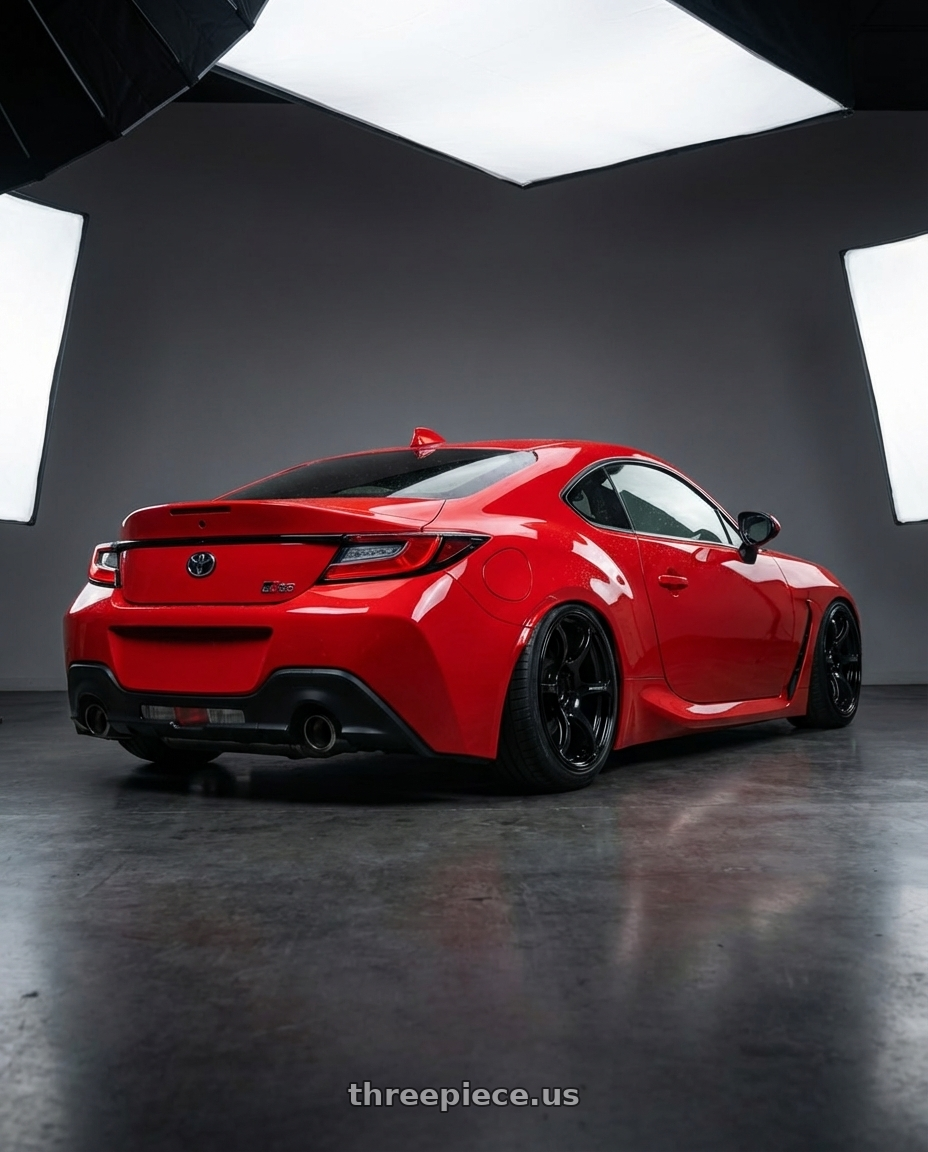 2024 Toyota GR86 with Advan RGIII 5x114.3 18x10+35 Gloss Black wheels rear three quarter view slight stretch tires