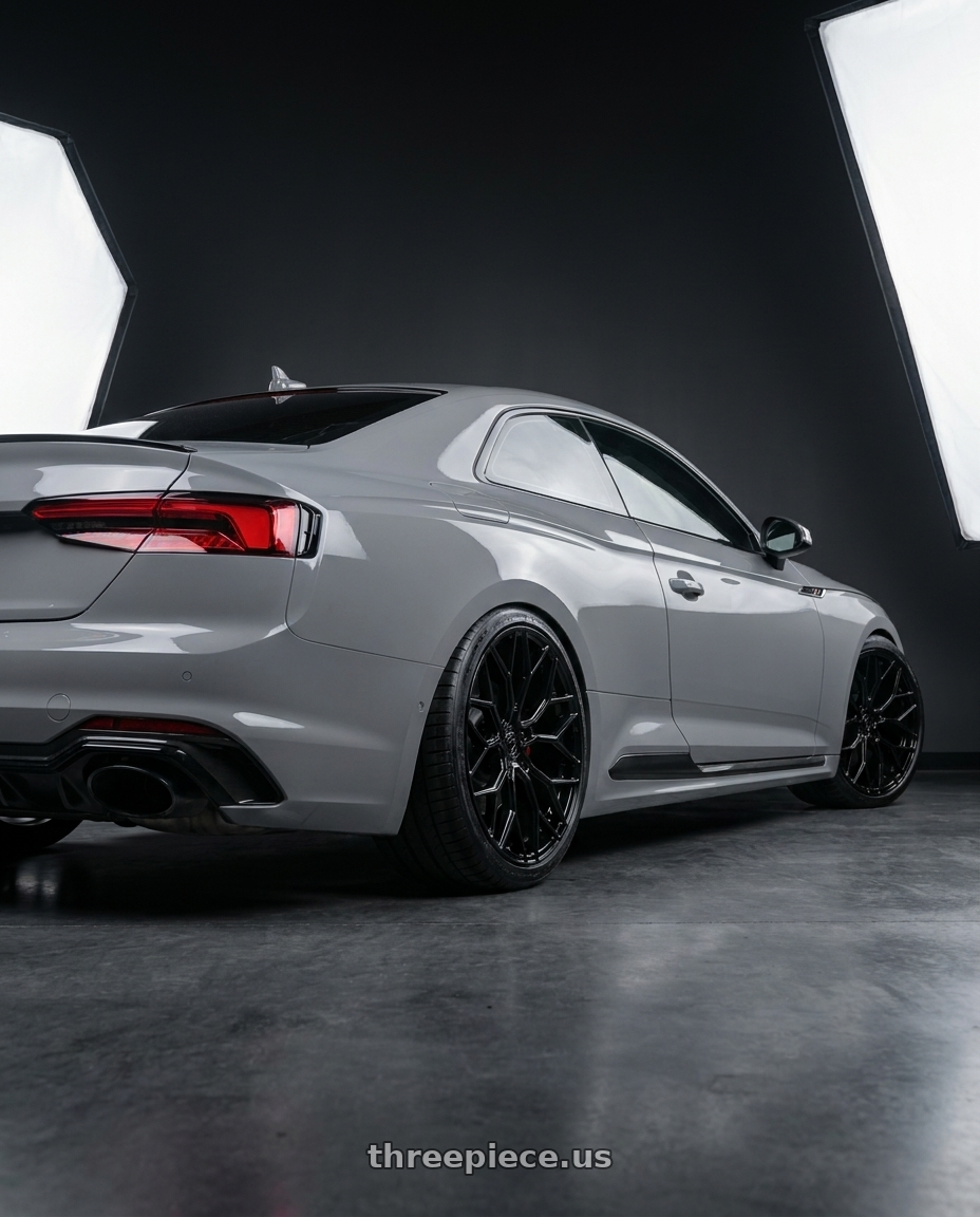 2018 Audi RS5 with DOLCE PERFORMANCE PISTA 5x112 19x8.5 +28 Gloss Black wheels rear three quarter view slight stretch tires