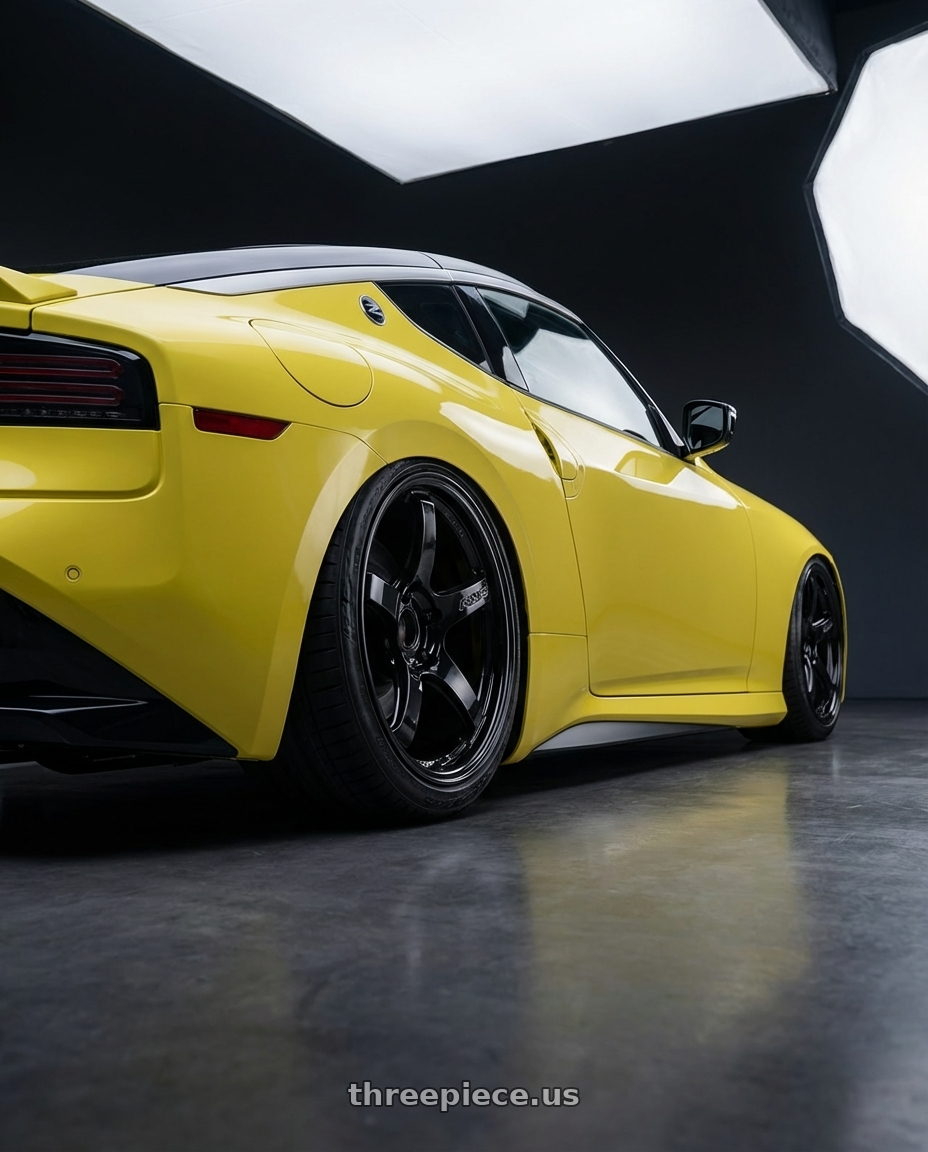 2024 Nissan Z with Gram Lights 57CR 5x114.3 19x8.5+35 Glossy Black wheels rear three quarter view slight stretch tires