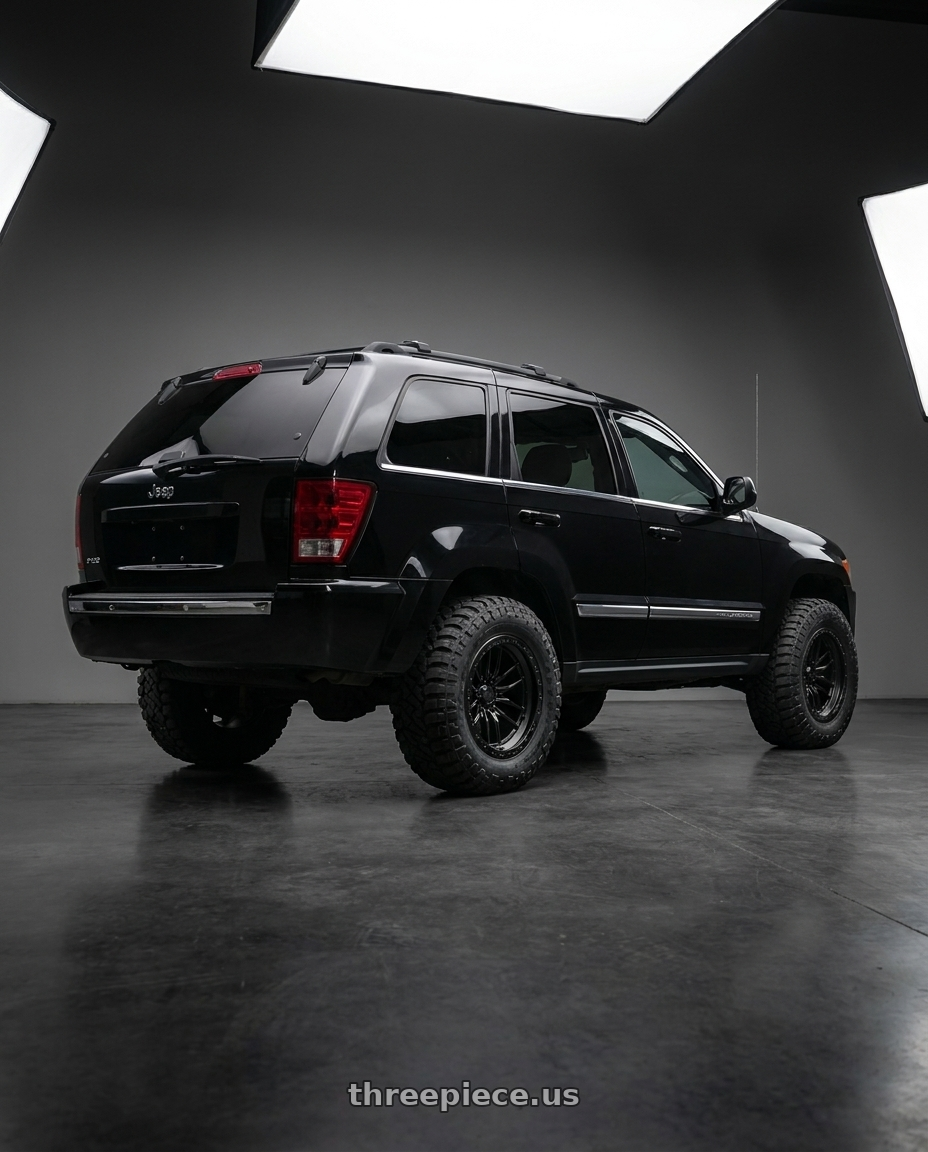 2006 Jeep Grand Cherokee with LOCK OFFROAD KRAWLER 5x127 18x9 -12 Matte Black W Matte Black Ring wheels rear three quarter view meaty tires