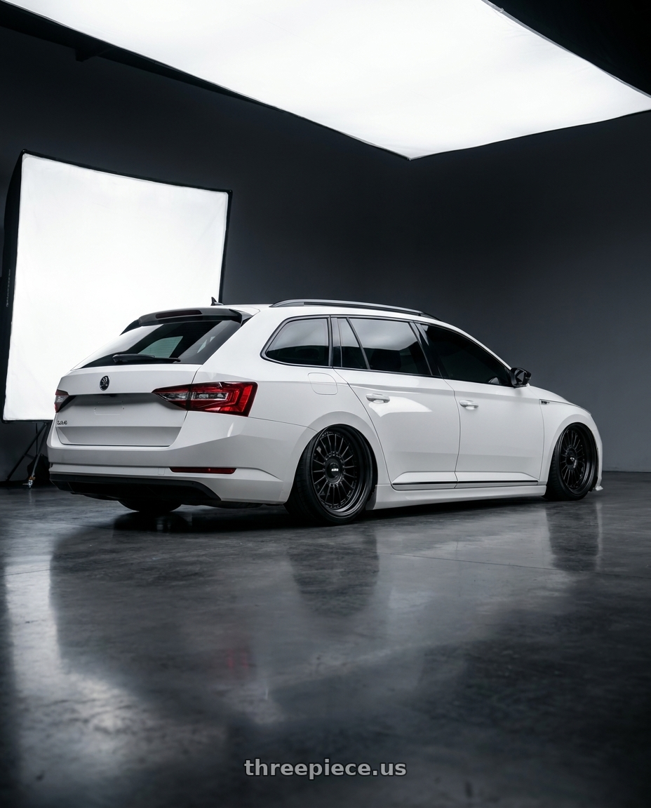2018 Skoda superb combi with Rotiform 1PC R142 LAS-R BLANK 17X8 +30 MATTE BLACK wheels rear three quarter view slight stretch tires