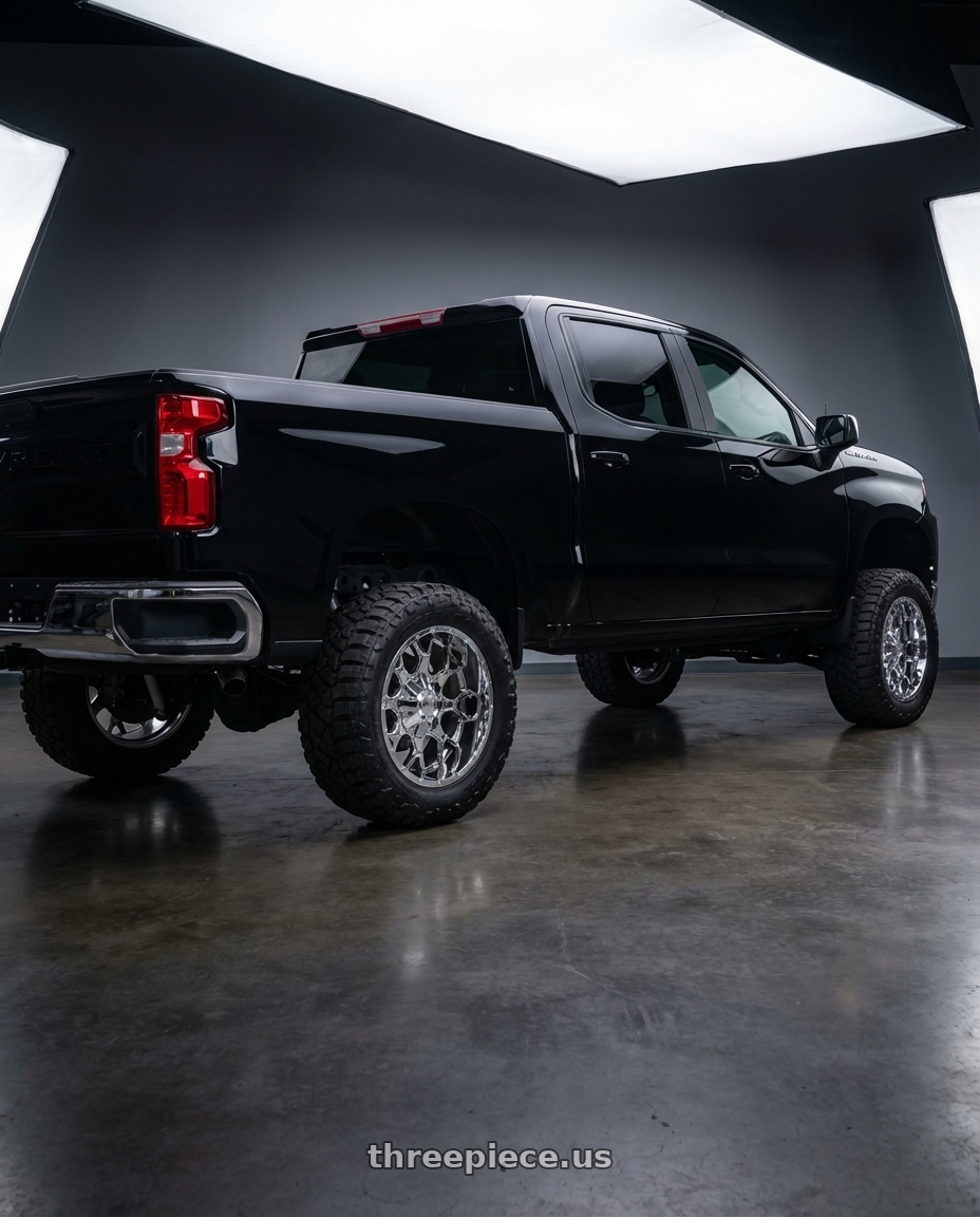 2023 Chevrolet silverado 1500 LT Black with Mayhem Warrior 8015 5x150/5x139.7 20x9+18 Chrome wheels rear three quarter view meaty tires