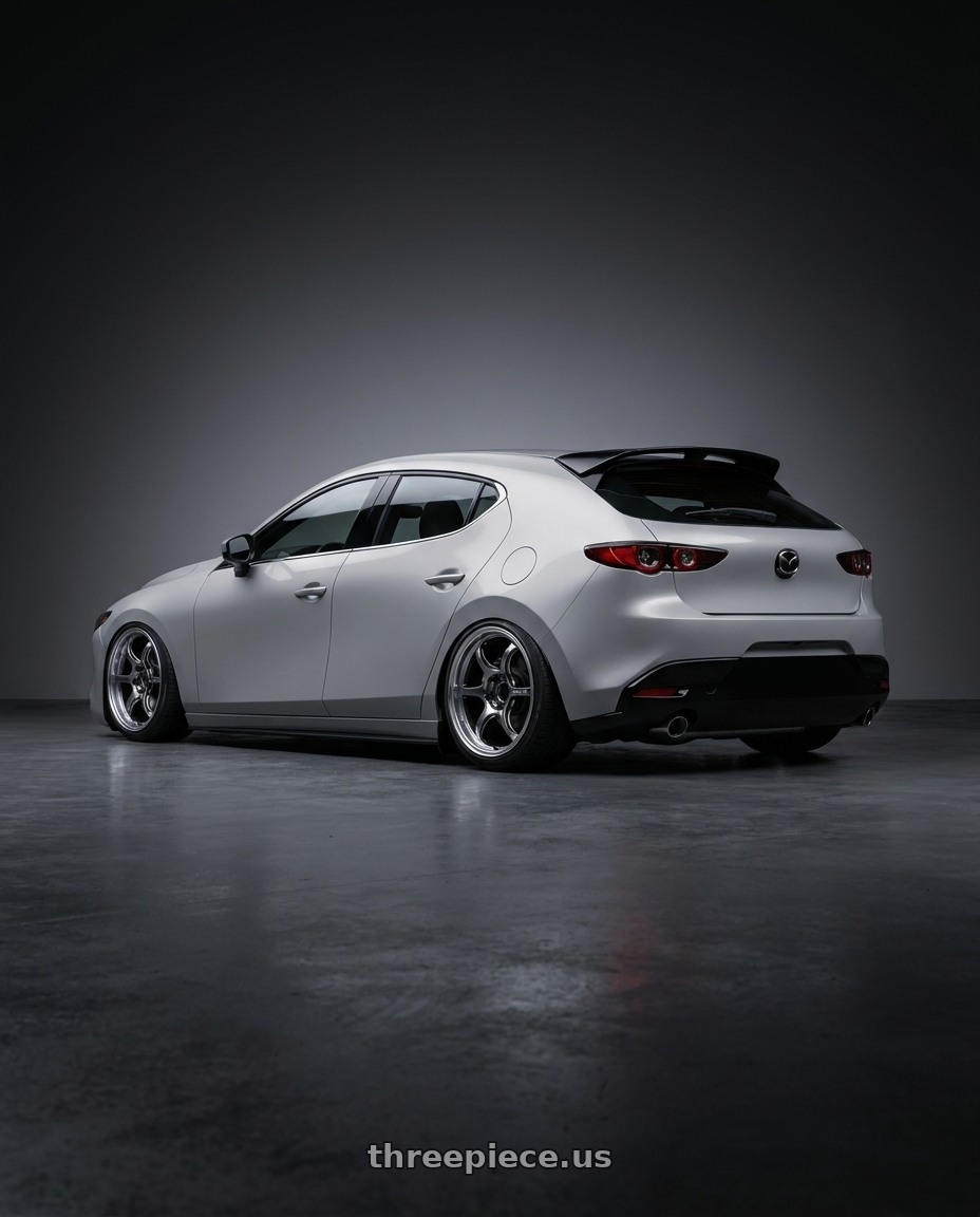 2026 mazda 3 with Advan Racing RG-D2 4x100 15x5.0 +45 MACHINING & RACING HYPER BLACK wheels rear three quarter view square tires