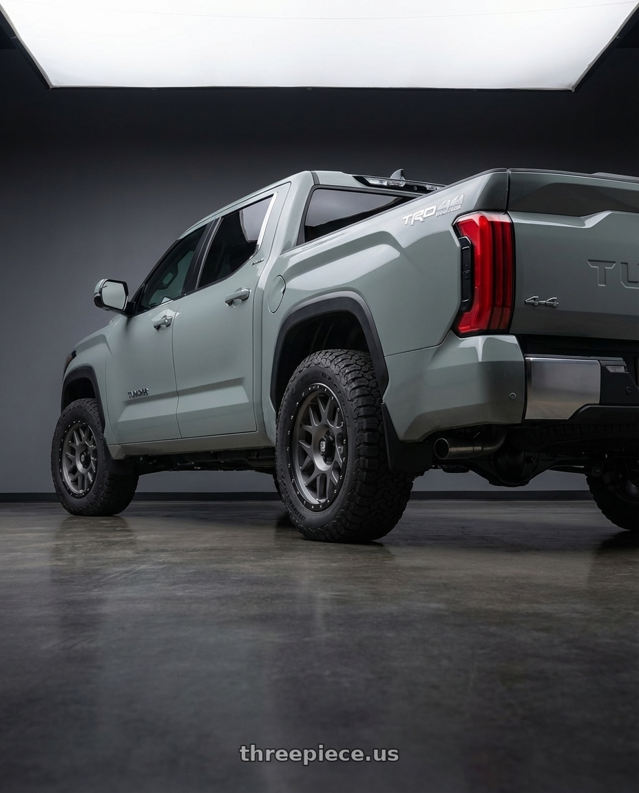 2024 Toyota Tundra with XD XD127 BULLY 6X139.7 20X9 +18 MATTE GRAY BLACK RING wheels rear three quarter view meaty tires