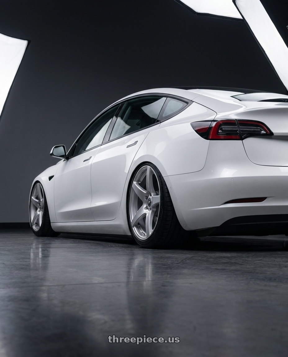 2023 Tesla Model 3 with Forgestar CF5 5x114.3 19x9.5 +29 Gloss Silver wheels rear three quarter view slight stretch tires