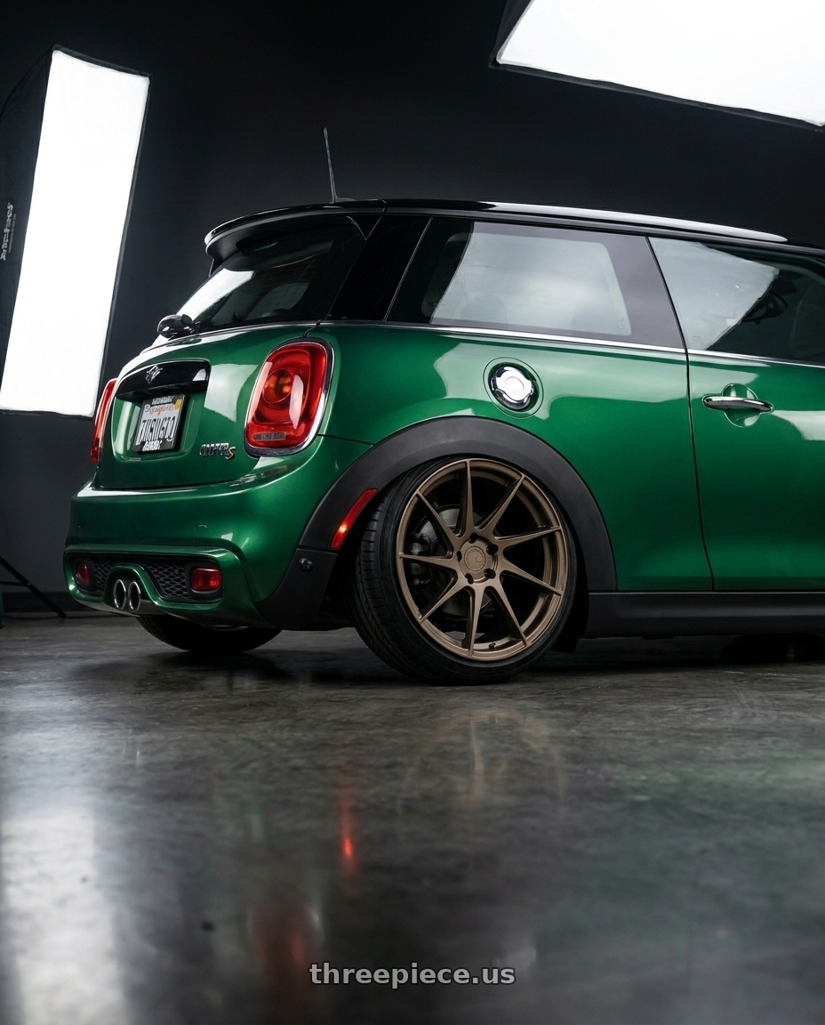 2018 Mini cooper s with Aodhan AH09 5x112 18x8.5 +35 Matte Bronze wheels rear three quarter view slight stretch tires
