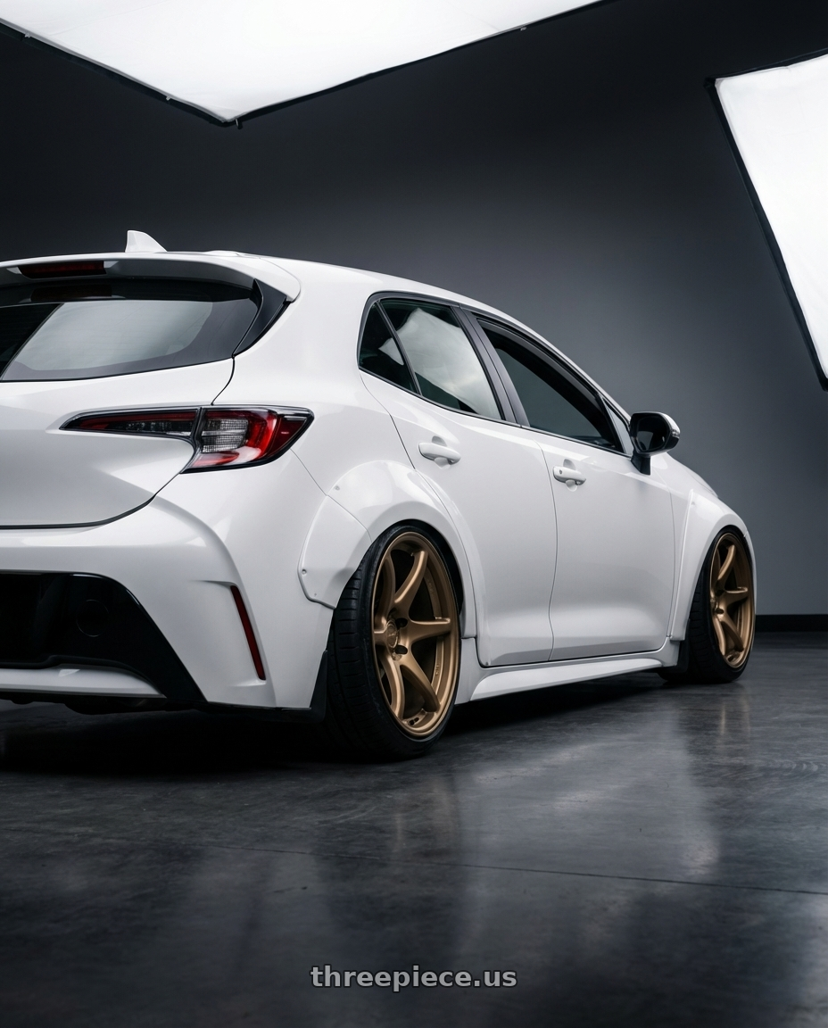 2023 Toyota Corolla Hatchback with Kansei K11B Tandem 5x114.3 18x10.5 12 Bronze wheels rear three quarter view slight stretch tires