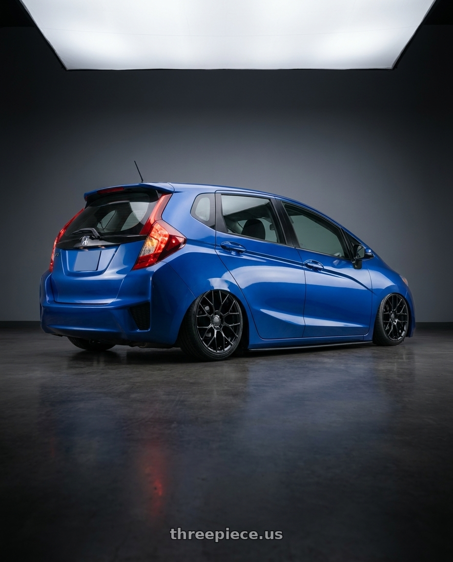 2018 Honda fit with Petrol P2B 5X100 15X7 +40 GLOSS BLACK wheels rear three quarter view slight stretch tires