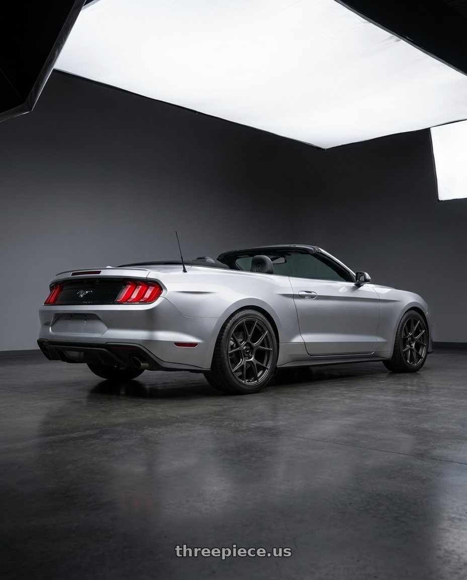 2018 ford mustang with Konig Ampliform 5x114.3 20x11+22 Dark Metallic Graphite wheels rear three quarter view square tires