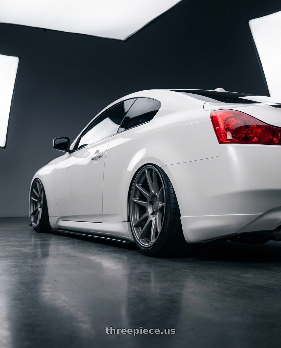 2014 Infiniti G37 Coupe with fifteen52 PODIUM 5x114.3 / 5x120 19x8.5 +35 FROSTED GRAPHITE (SATIN GREY) wheels rear three quarter view slight stretch tires