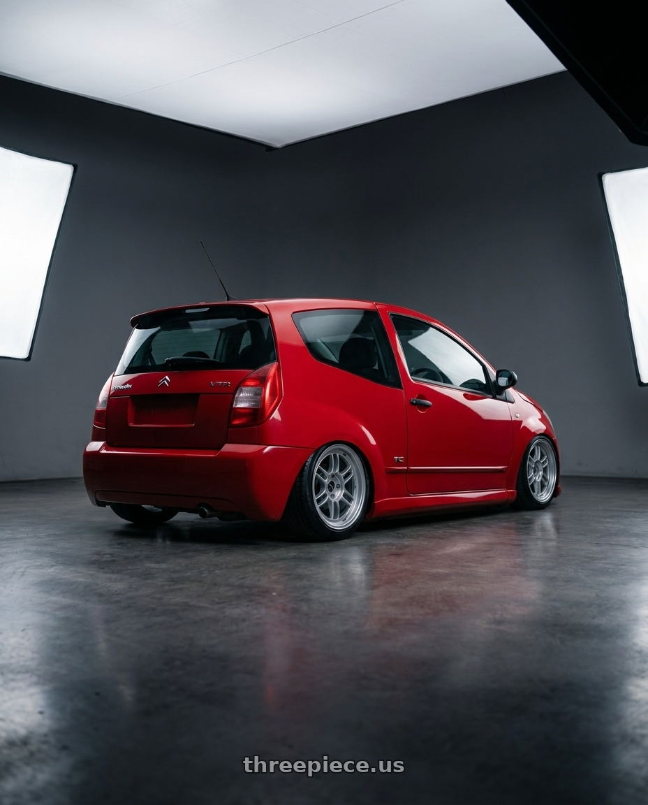 2003 Citroen c2 vtr with Enkei RPF1 4x100 15x8+28 Silver wheels rear three quarter view slight stretch tires