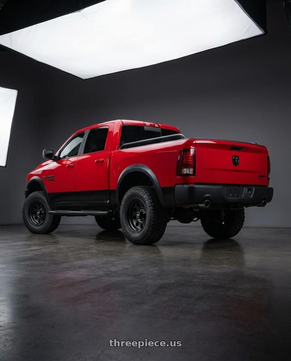 2017 RAM 1500 Rebel with American Racing AR172 BAJA 5X139.7 17X9 -12 SATIN BLACK wheels rear three quarter view meaty tires