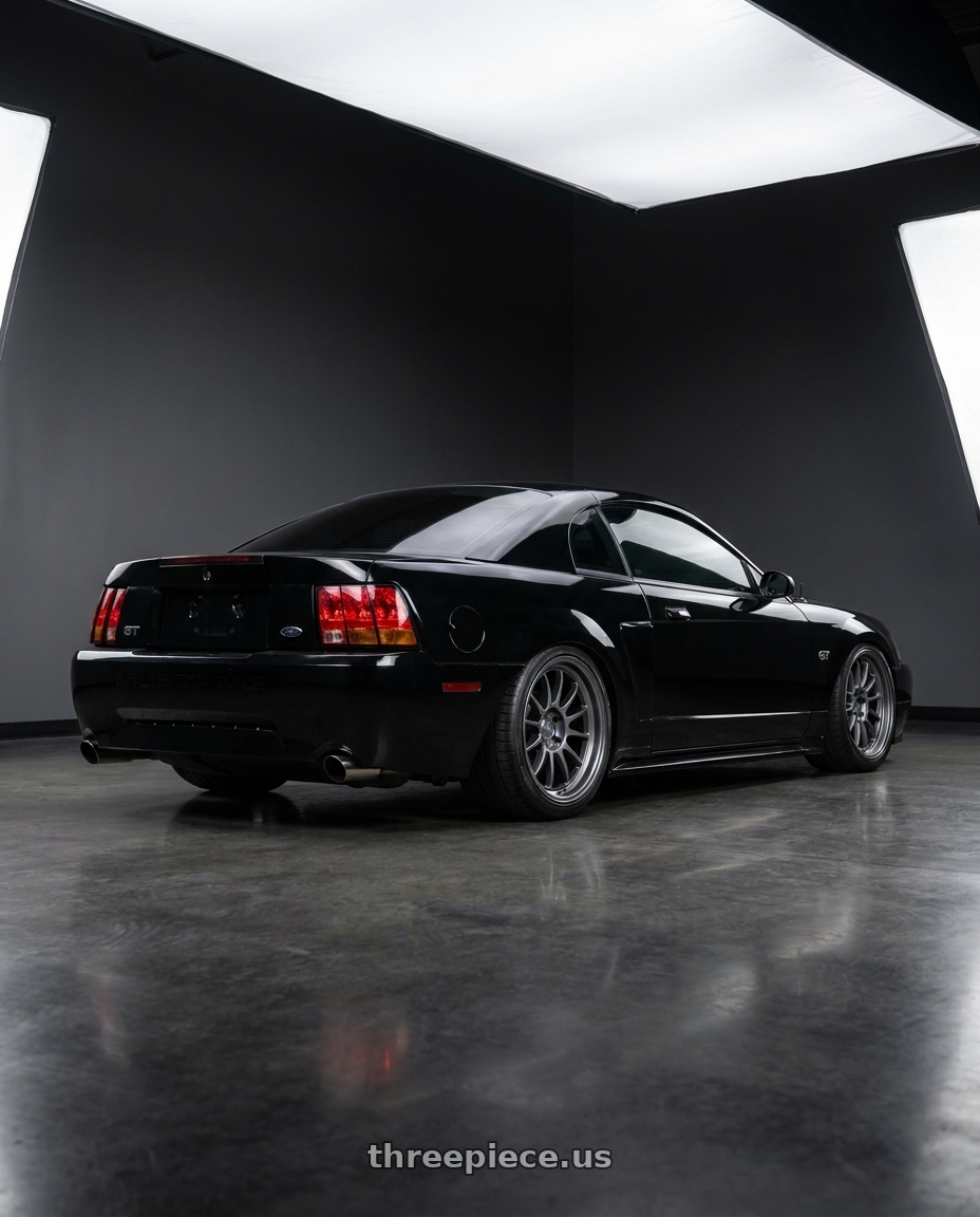 2002 Ford Mustang GT, Black with Kansei K13G Corsa 5x114.3 18x10.5 12 Gunmetal wheels rear three quarter view slight stretch tires