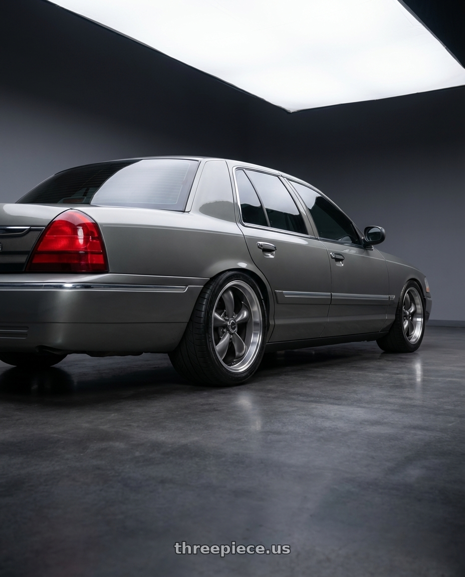 2004 Mercury Grand marquis  with American Racing AR105 TORQ THRUST M 5X114.3 18X9 +24 ANTHRACITE W/ MACHINED LIP wheels rear three quarter view meaty tires