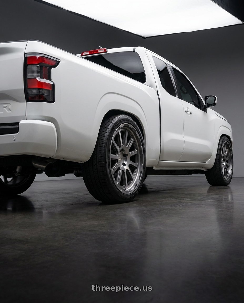 2025 nissan frontier king cab with Black Rhino CHASE 6X139.7 20X9 +12 BRUSHED GUNMETAL wheels rear three quarter view slight stretch tires
