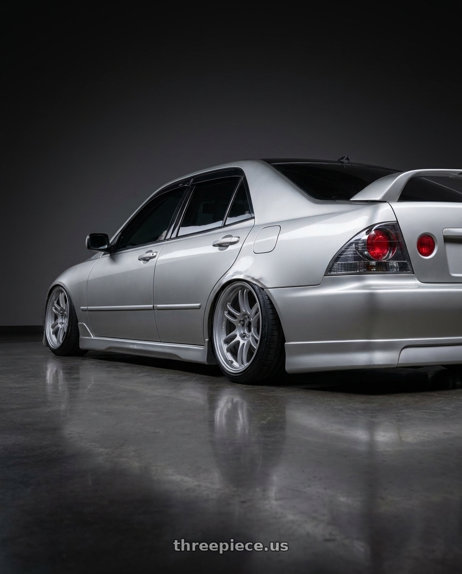 2002 Lexus Is300 with Gram Lights 57DR 5x114.3 18x9.5+22 Grace Silver wheels rear three quarter view slight stretch tires