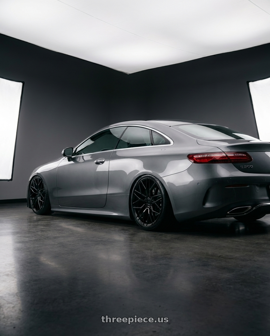 2022 Mercedes benz e 200 coupe with KATANA RACING KR01 5x108 17x7.5 +40 Glossy Black wheels rear three quarter view slight stretch tires