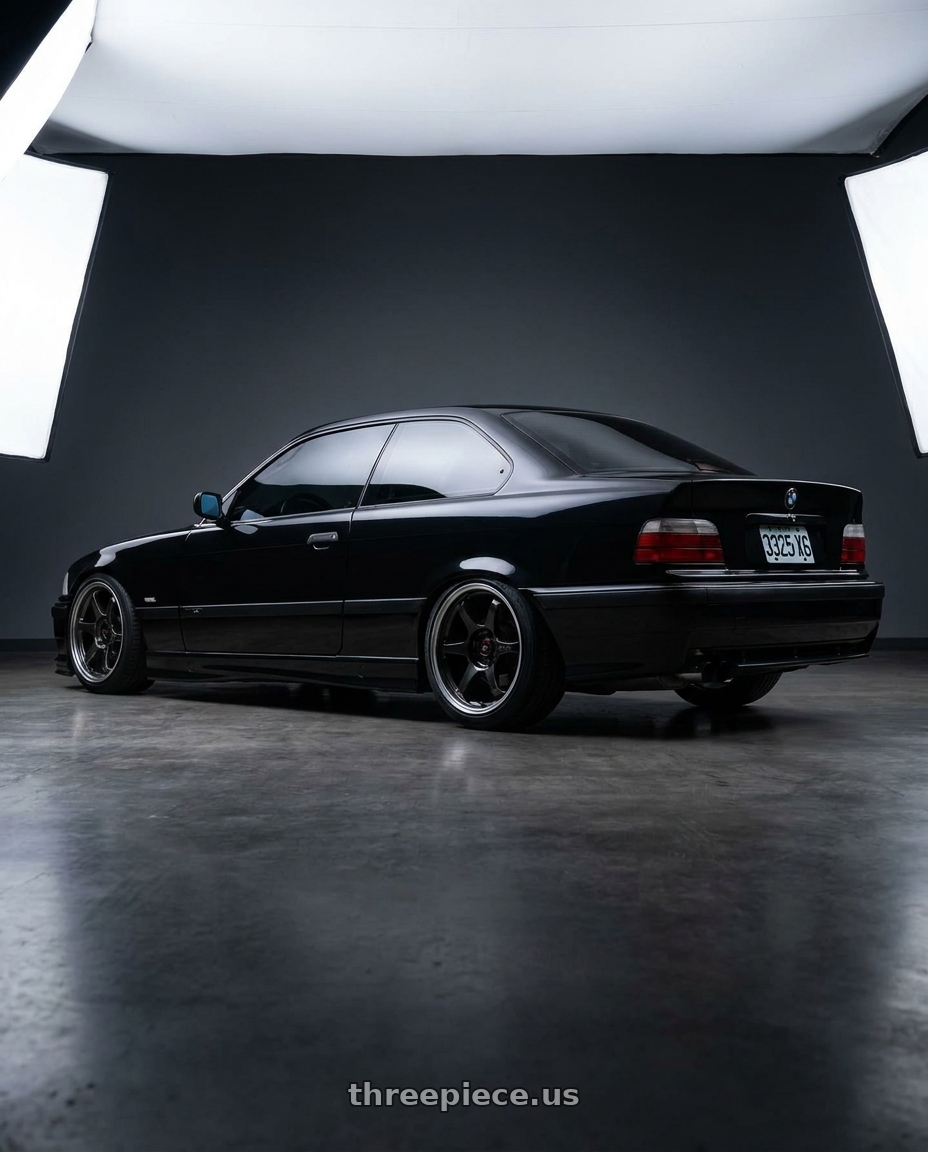 1993 BMW E36 325i coupe with Enkei PF06 5x114.3 16x8+30 Black Machined wheels rear three quarter view square tires