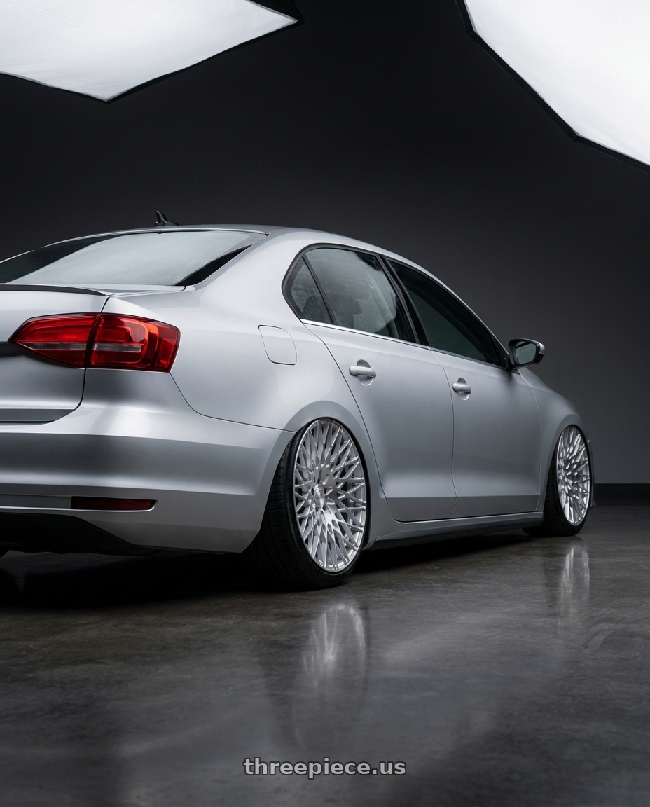 2016 Volkswagen Jetta GLI MK6 with Avant Garde Wheels M540 5X112 18x9 +48 Silver Machined wheels rear three quarter view slight stretch tires
