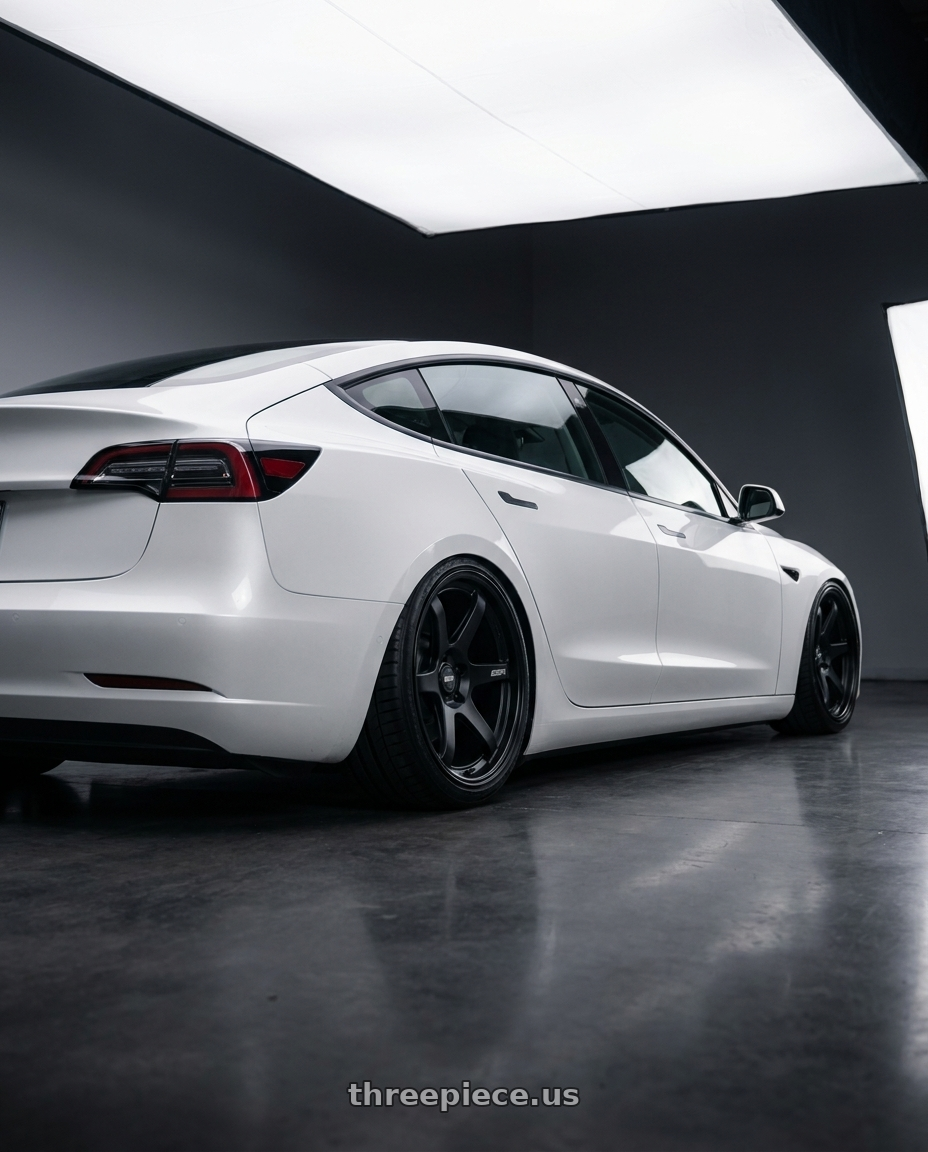 2023 Tesla Model 3 with ESR Wheels APEX SERIES AP6 5x114.3 19x9.5 +22 Matte Black wheels rear three quarter view slight stretch tires