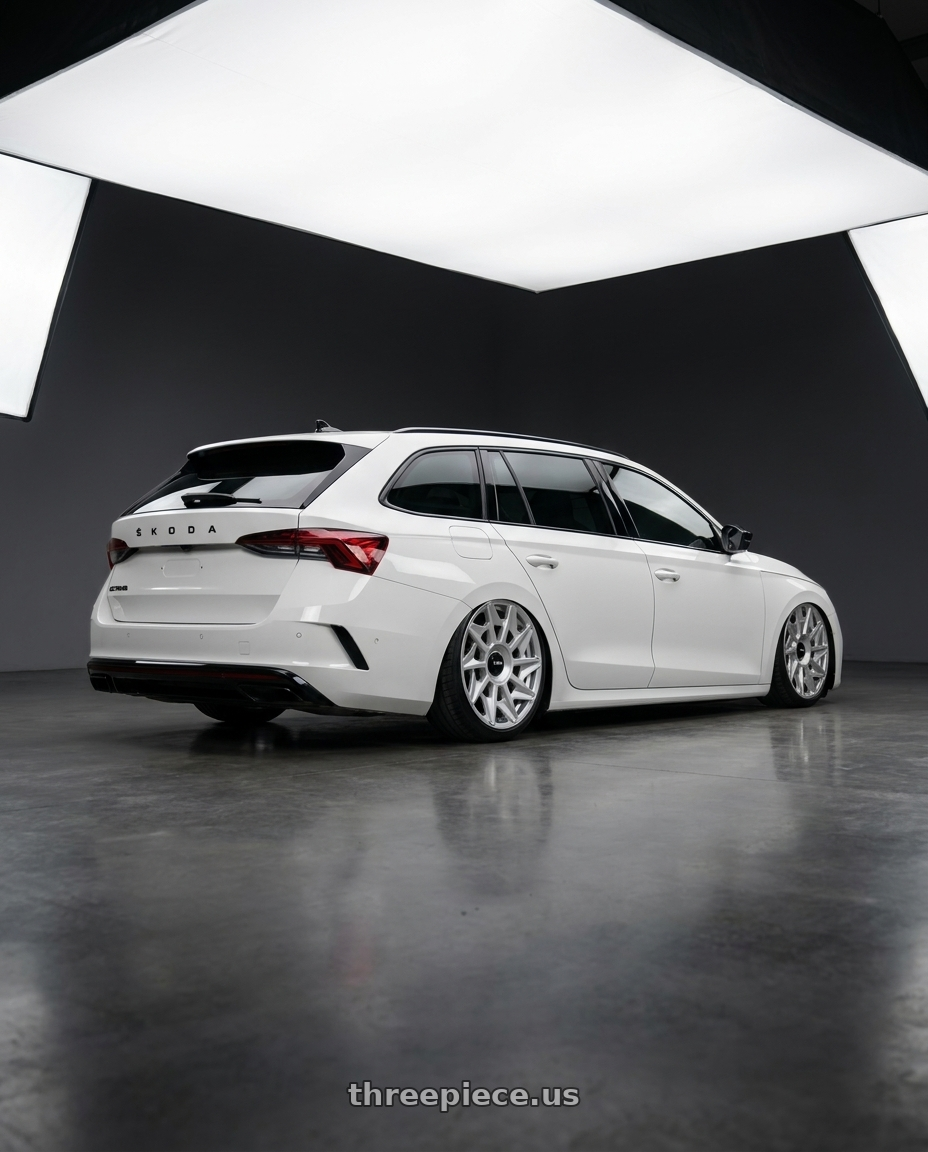 2025 SKODA OCTAVIA with Rotiform 1PC R124 CVT 5X112 19X8.5 +45 GLOSS SILVER wheels rear three quarter view slight stretch tires