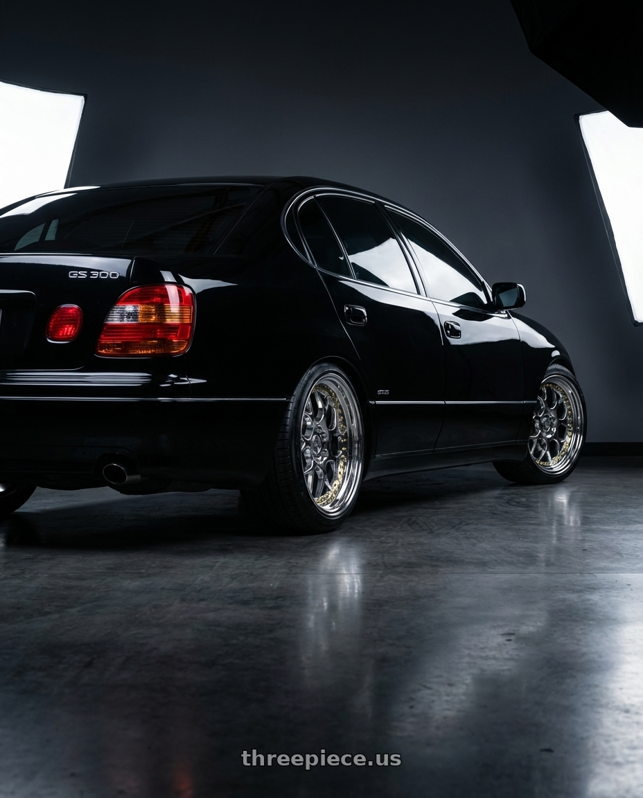 2003 lexus gs300 sport design with Aodhan DS01 5x114.3 18x8.5+35 Vacuum Chrome W/ Gold Rivets wheels rear three quarter view slight stretch tires