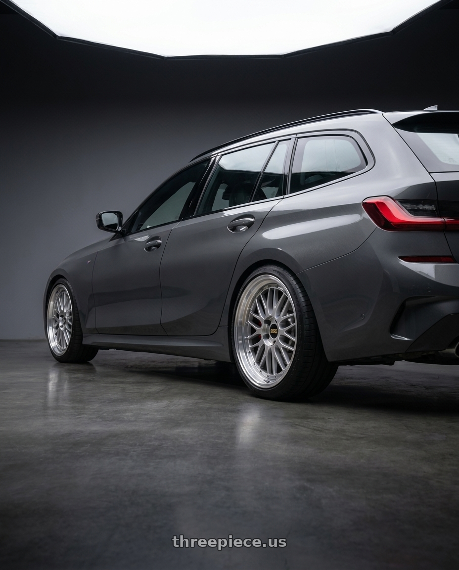 2023 bmw g21 with BBS LM 5x114.3 20x10.0+38 Diamond Silver wheels rear three quarter view square tires