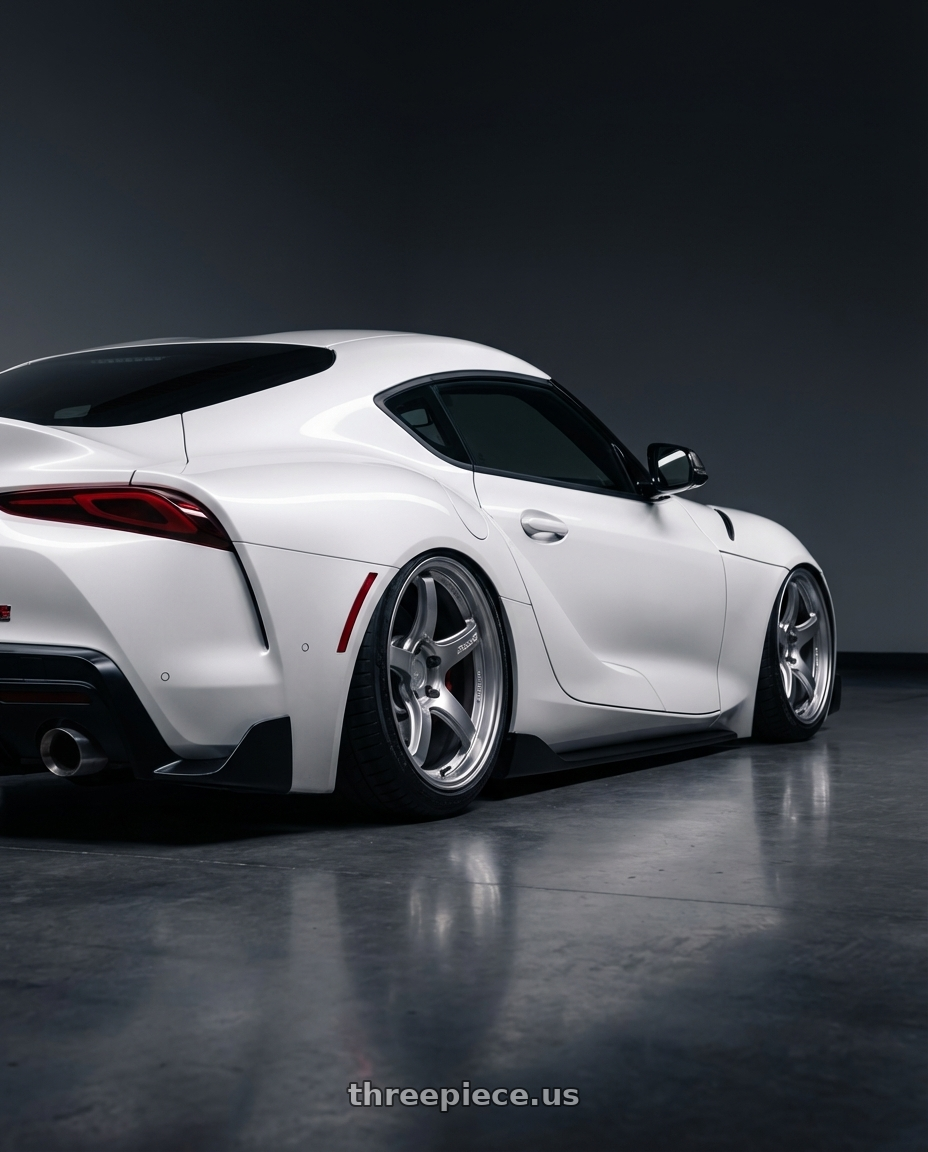 2021 Toyota Supra  with Gram Lights 57CR 5x112 19x9.5 +25 GRACE SILVER wheels rear three quarter view slight stretch tires