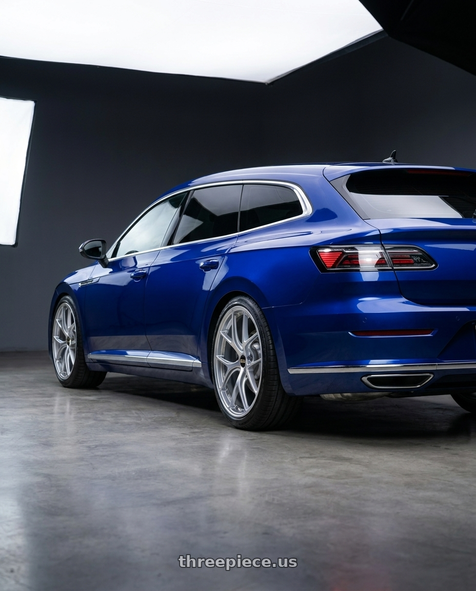 2023 vw Arteon shooting brake Lapiz Blue with BBS RI-D 5x112 20x9.5 +10 Diamond Silver wheels rear three quarter view slight stretch tires
