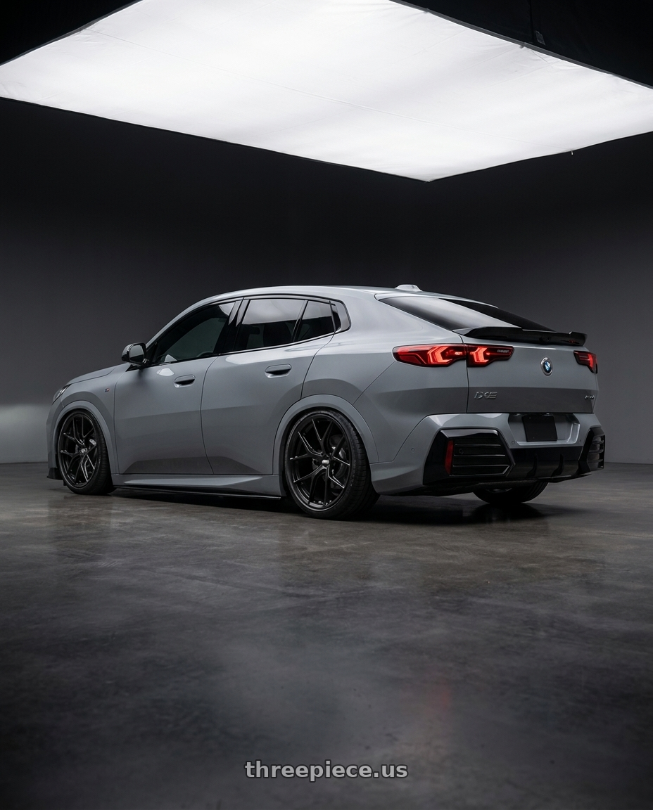 2025 Bmw ix2 alpine grey with BBS FI-R Evo 5x112 19x9.5+15 Satin Black wheels rear three quarter view slight stretch tires