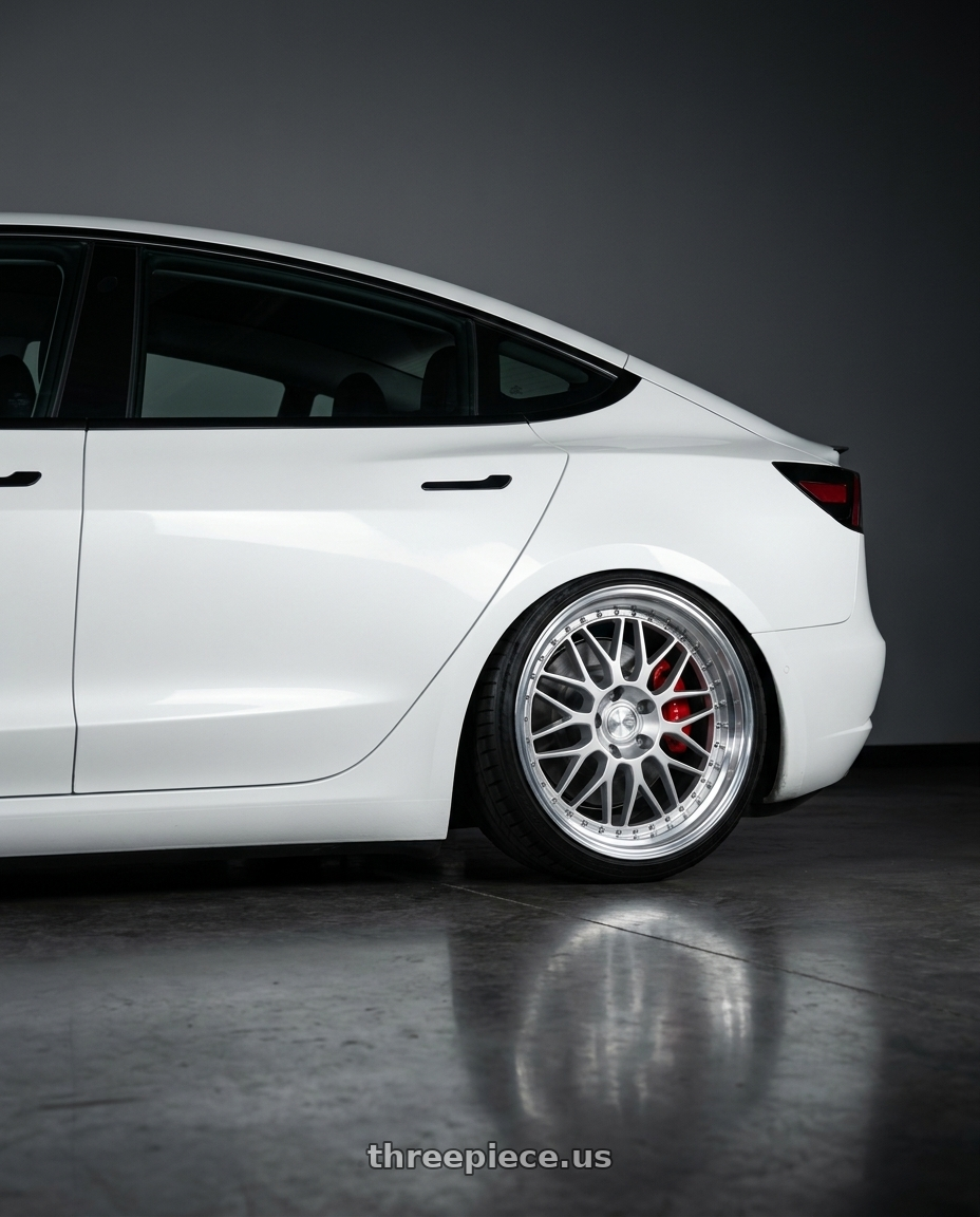 2018 Tesla Model 3 with Aodhan AH02 5x114.3 19x9.5+12 Silver w/ Machined Lip wheels rear three quarter view slight stretch tires